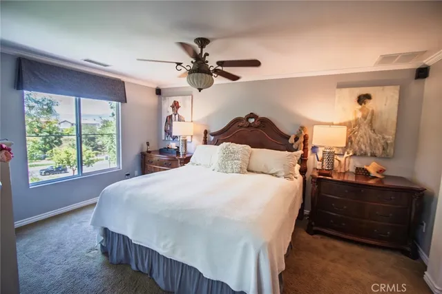 a bed room with a bed and a window