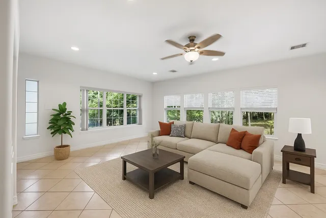 a living room with furniture and a large window
