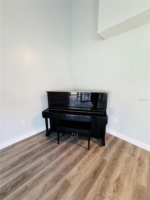 4100 Player Circle, Unit 101 Orlando, FL 32808 - Photo 12 of 34 a sitting area with wooden floor