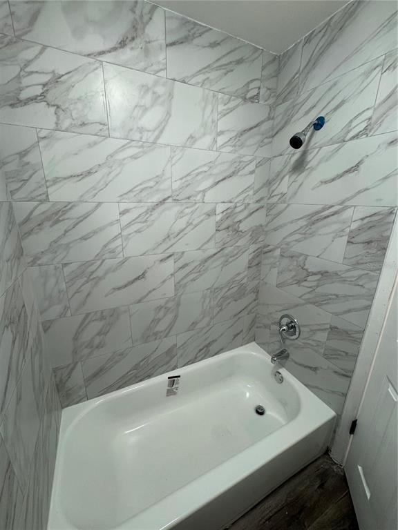 4100 Player Circle, Unit 101 Orlando, FL 32808 - Photo 19 of 34 a bathroom with a sink and vanity