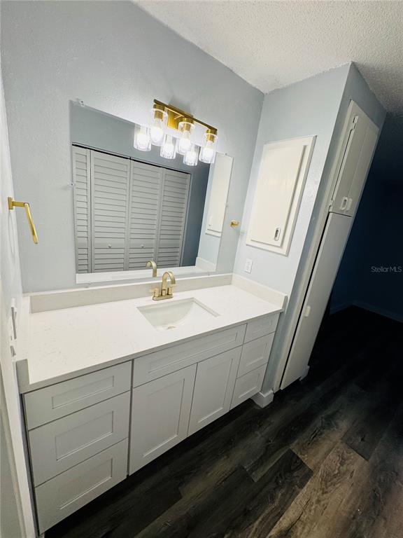 4100 Player Circle, Unit 101 Orlando, FL 32808 - Photo 21 of 34 a bathroom with a sink and a mirror