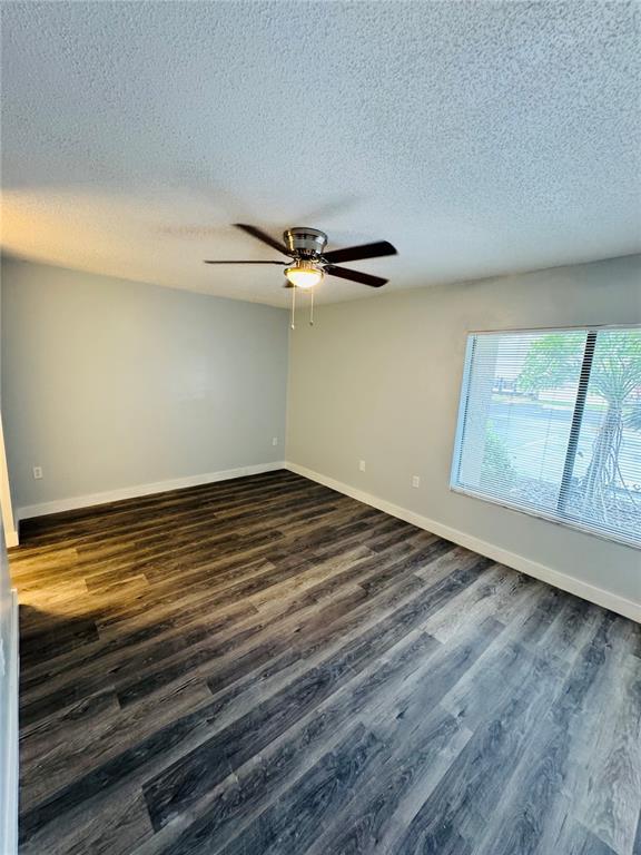 4100 Player Circle, Unit 101 Orlando, FL 32808 - Photo 22 of 34 a view of room and wooden floor