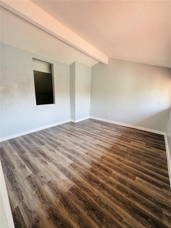 4100 Player Circle, Unit 101 Orlando, FL 32808 - Photo 25 of 34 a bedroom with a bed and a flat screen tv