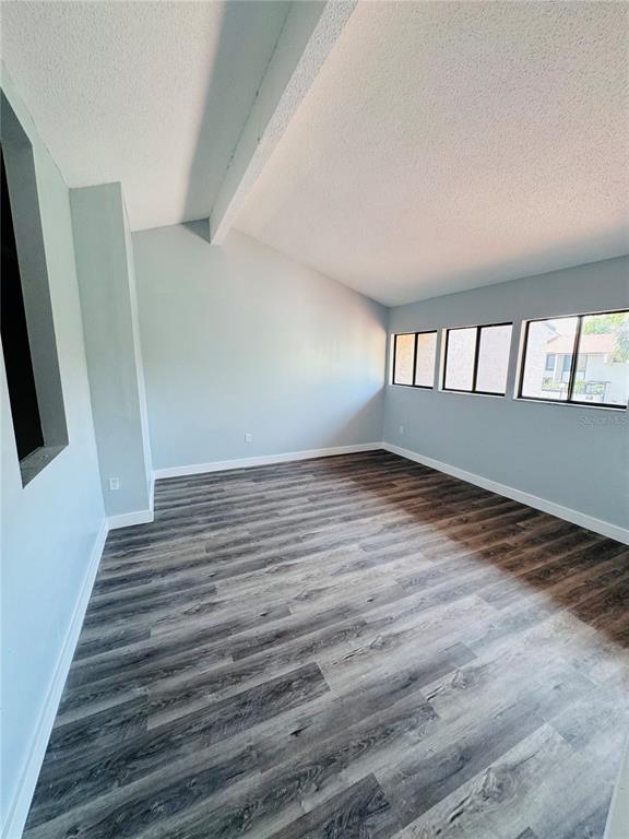 4100 Player Circle, Unit 101 Orlando, FL 32808 - Photo 26 of 34 wooden floor in an empty room with a window