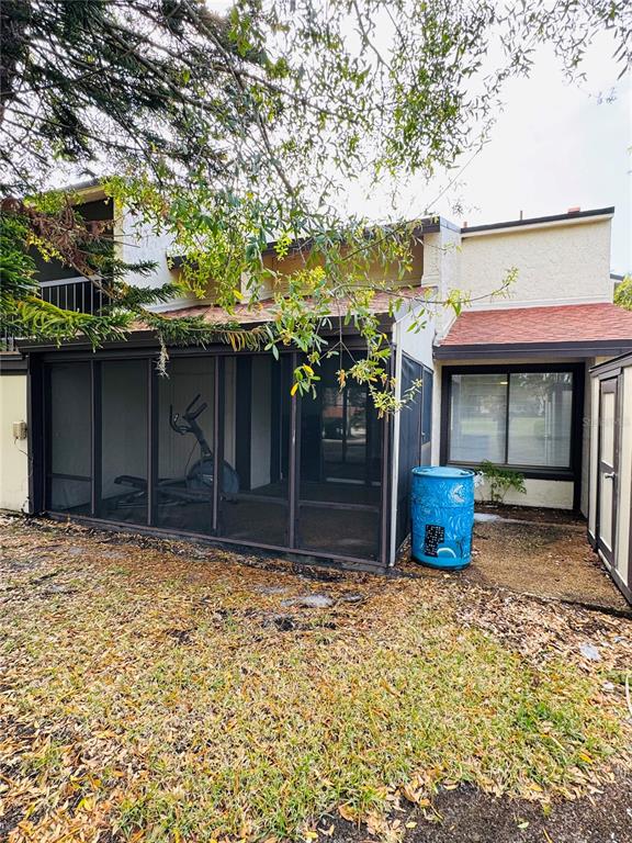 4100 Player Circle, Unit 101 Orlando, FL 32808 - Photo 33 of 34 a front view of a house with a garden