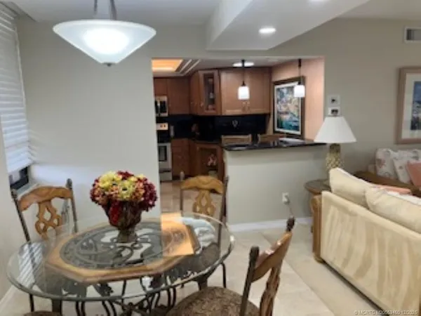 a living room with furniture and a lamp