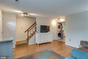 17 Devon Court Sterling, VA 20165 - Photo 5 of 30 a view of a livingroom with furniture and stairs