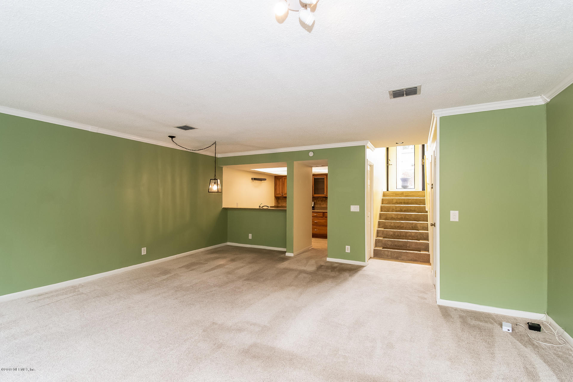 5478 Stanford Road Jacksonville, FL 32207 - Photo 12 of 26 an empty room with closet and windows
