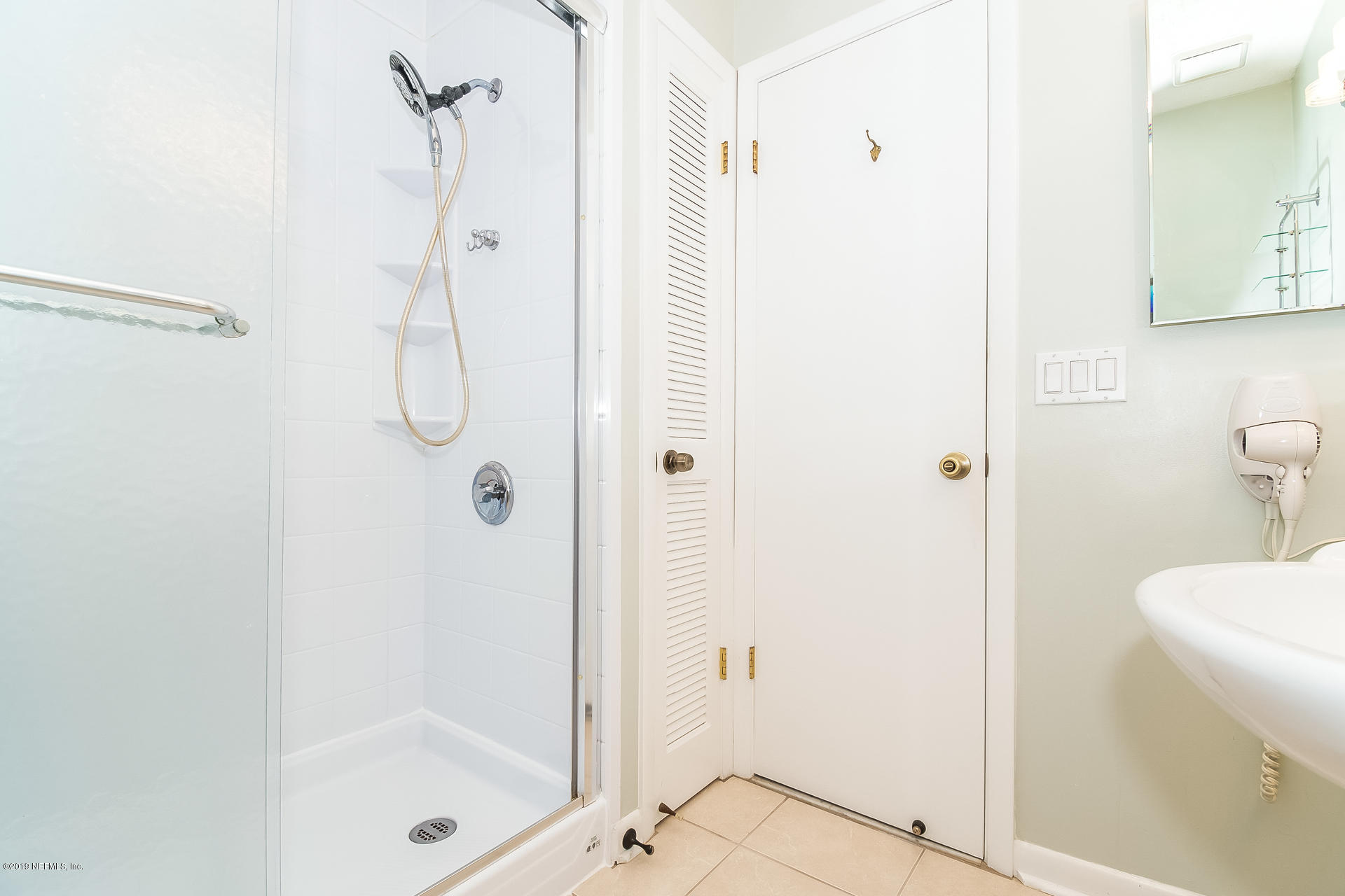5478 Stanford Road Jacksonville, FL 32207 - Photo 17 of 26 a bathroom with a shower and a view of a bathroom