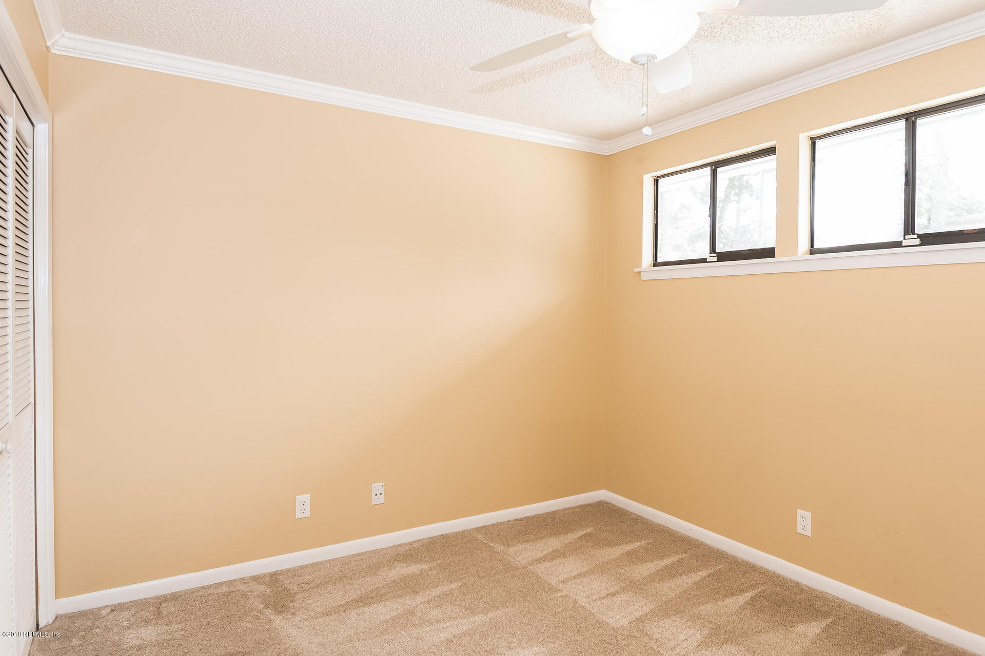 5478 Stanford Road Jacksonville, FL 32207 - Photo 18 of 26 an empty room with windows