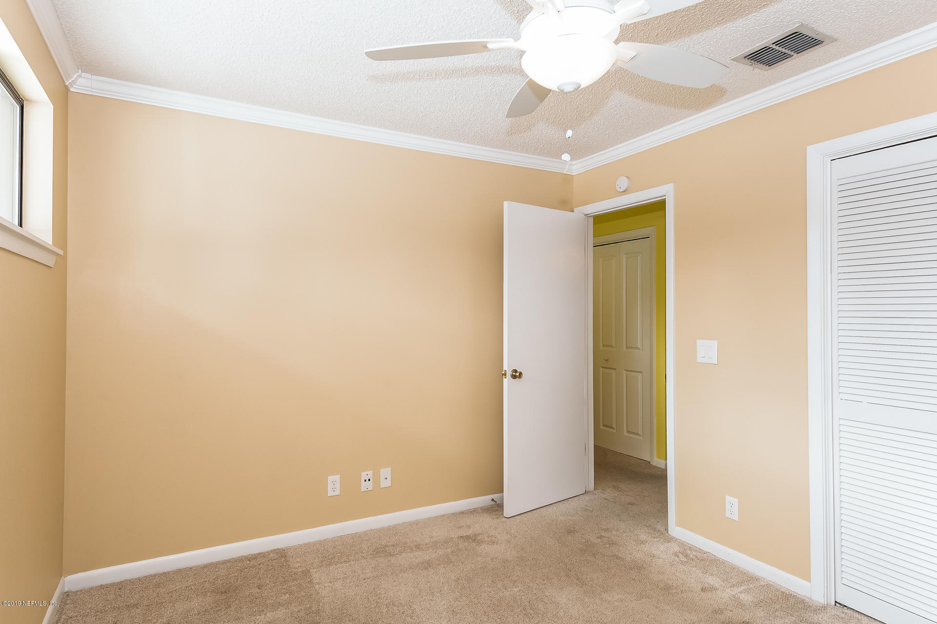 5478 Stanford Road Jacksonville, FL 32207 - Photo 19 of 26 a view of an empty room with a window