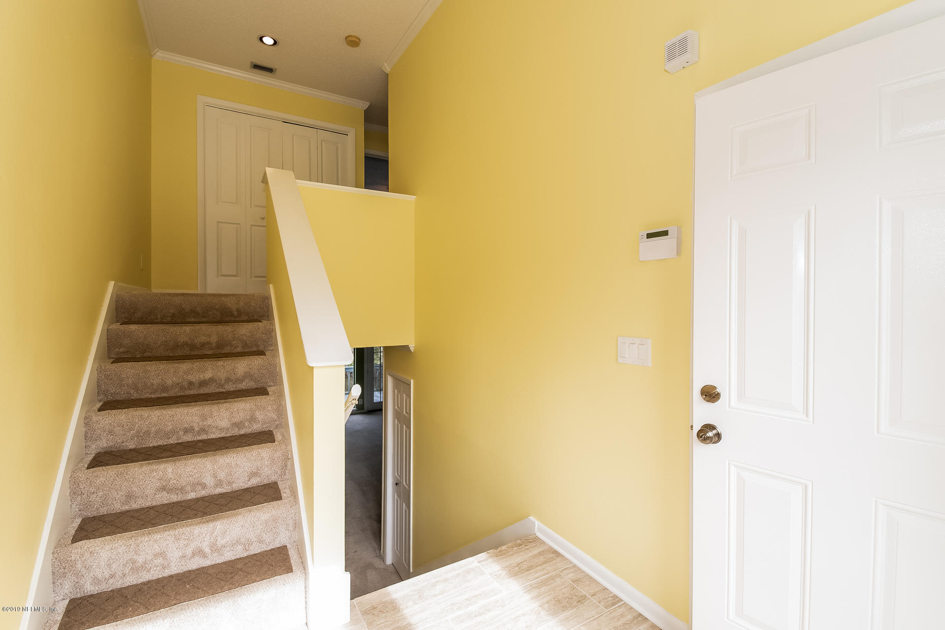 5478 Stanford Road Jacksonville, FL 32207 - Photo 7 of 26 a view of a hallway with staircase