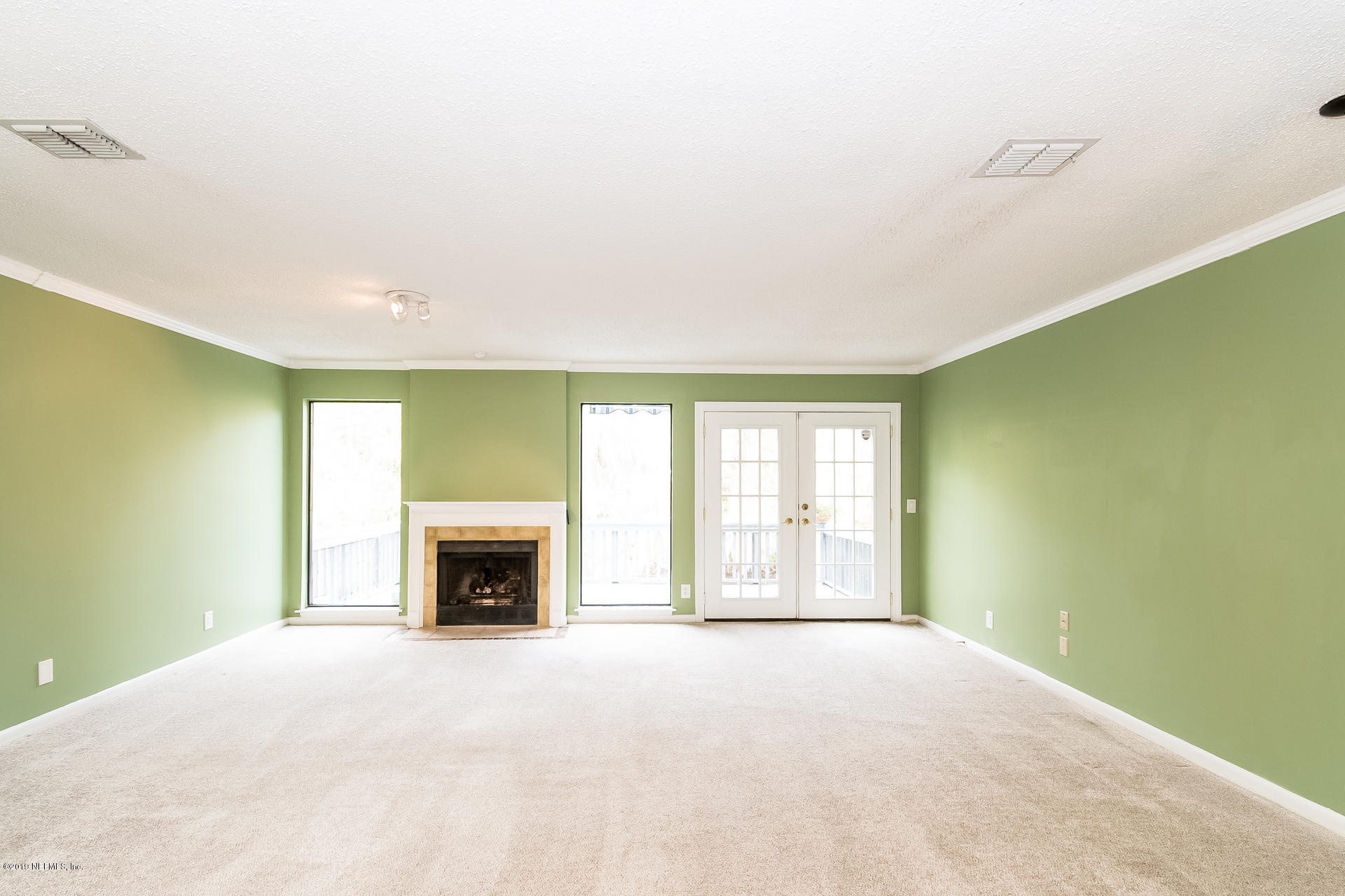 5478 Stanford Road Jacksonville, FL 32207 - Photo 10 of 26 a view of empty room with a fireplace