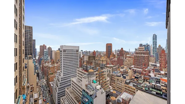 a view of a city with tall buildings