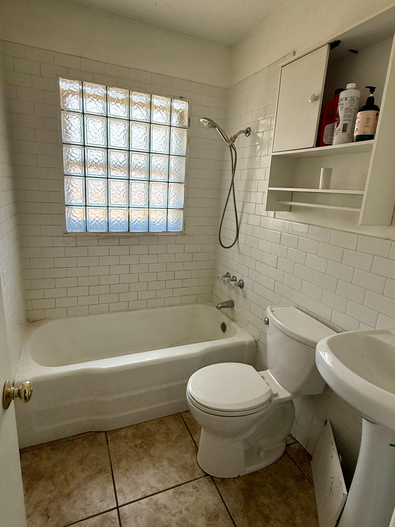 2817 63rd Street Lubbock, TX 79413 - Photo 9 of 16 a bathroom with a toilet and a bath tub