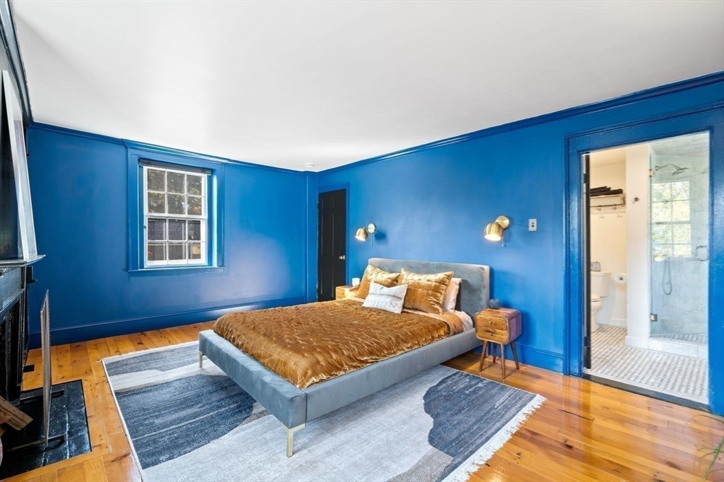 46 Church Street Dedham, MA 02026 - Photo 22 of 42 a bedroom with a bed and wooden floor