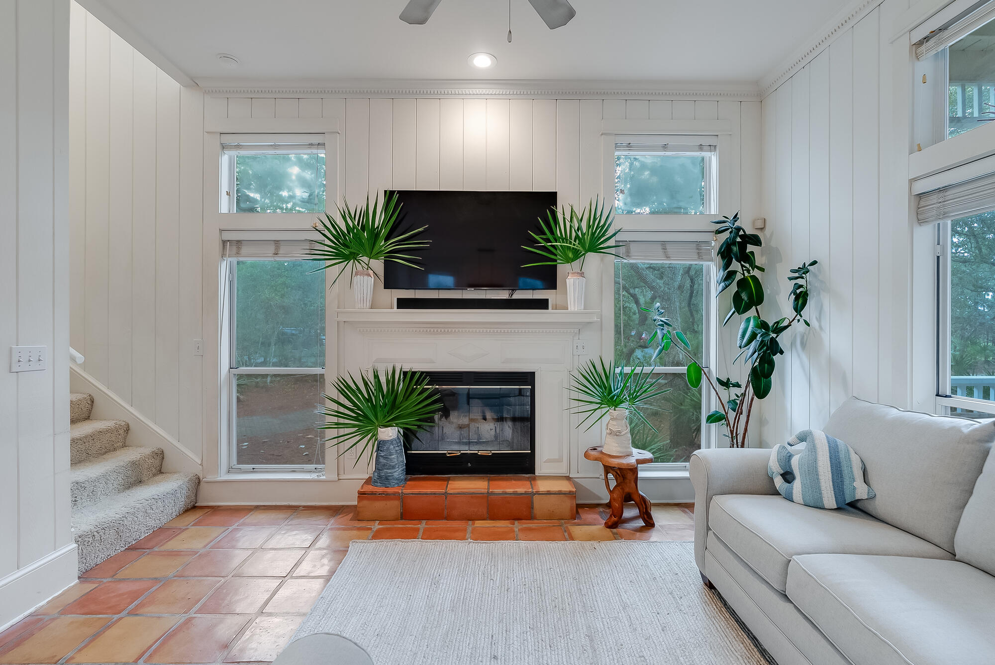 180 Wilderness Way Santa Rosa Beach, FL 32459 - Photo 13 of 69 a living room with furniture a potted plant and a fireplace