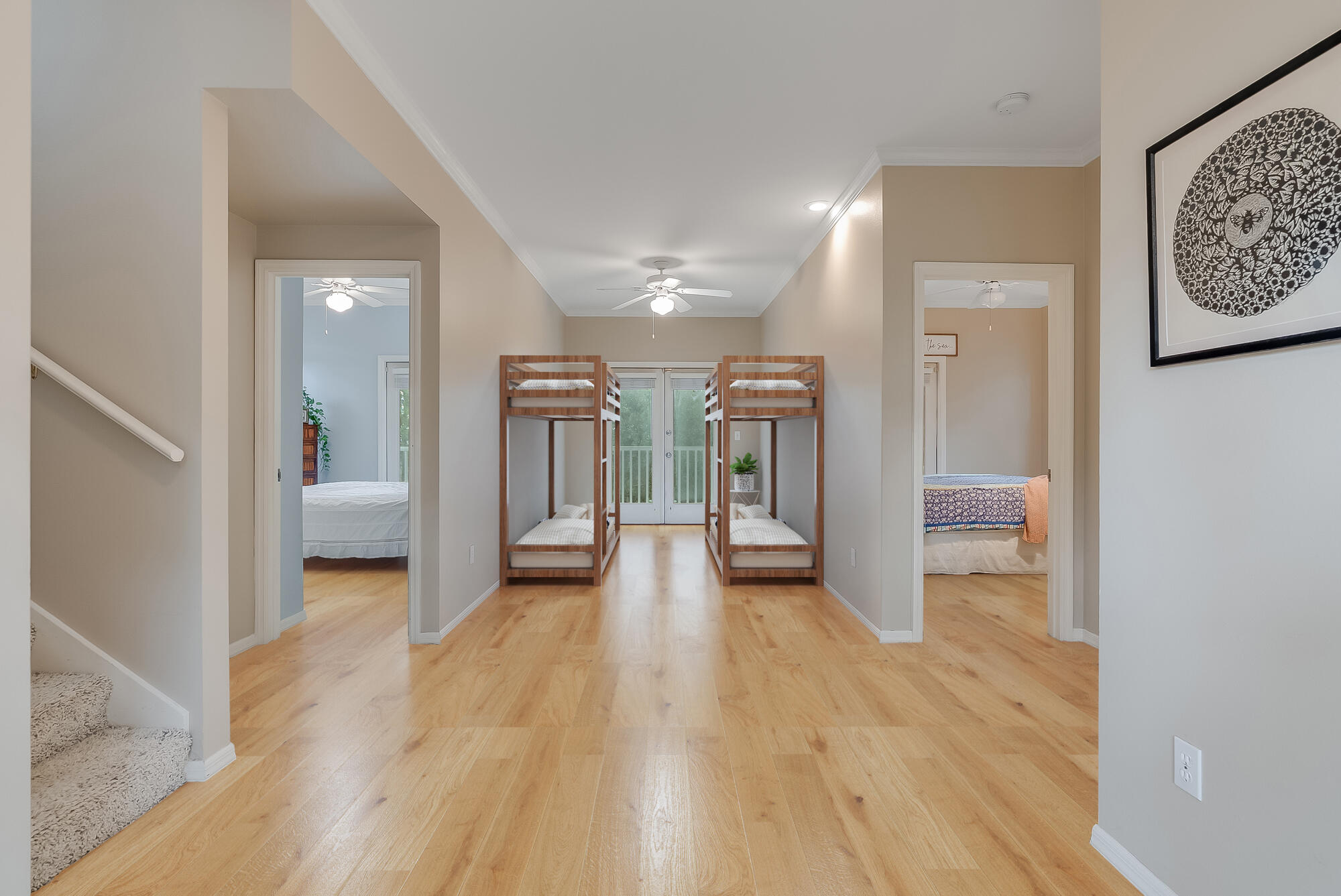 180 Wilderness Way Santa Rosa Beach, FL 32459 - Photo 17 of 69 a view of a hallway with wooden floor and a bathroom
