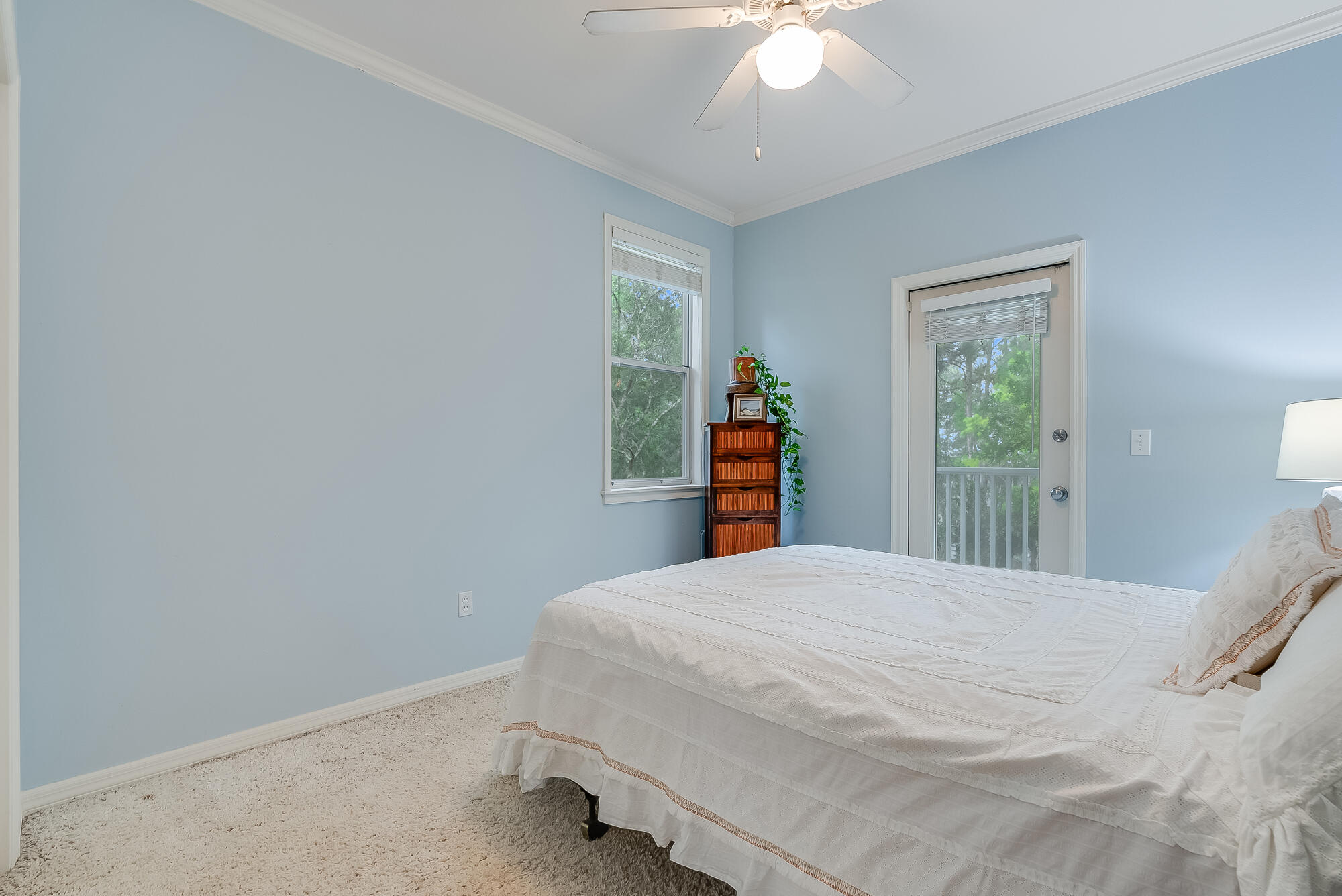 180 Wilderness Way Santa Rosa Beach, FL 32459 - Photo 21 of 69 a bedroom with a bed and a chandelier