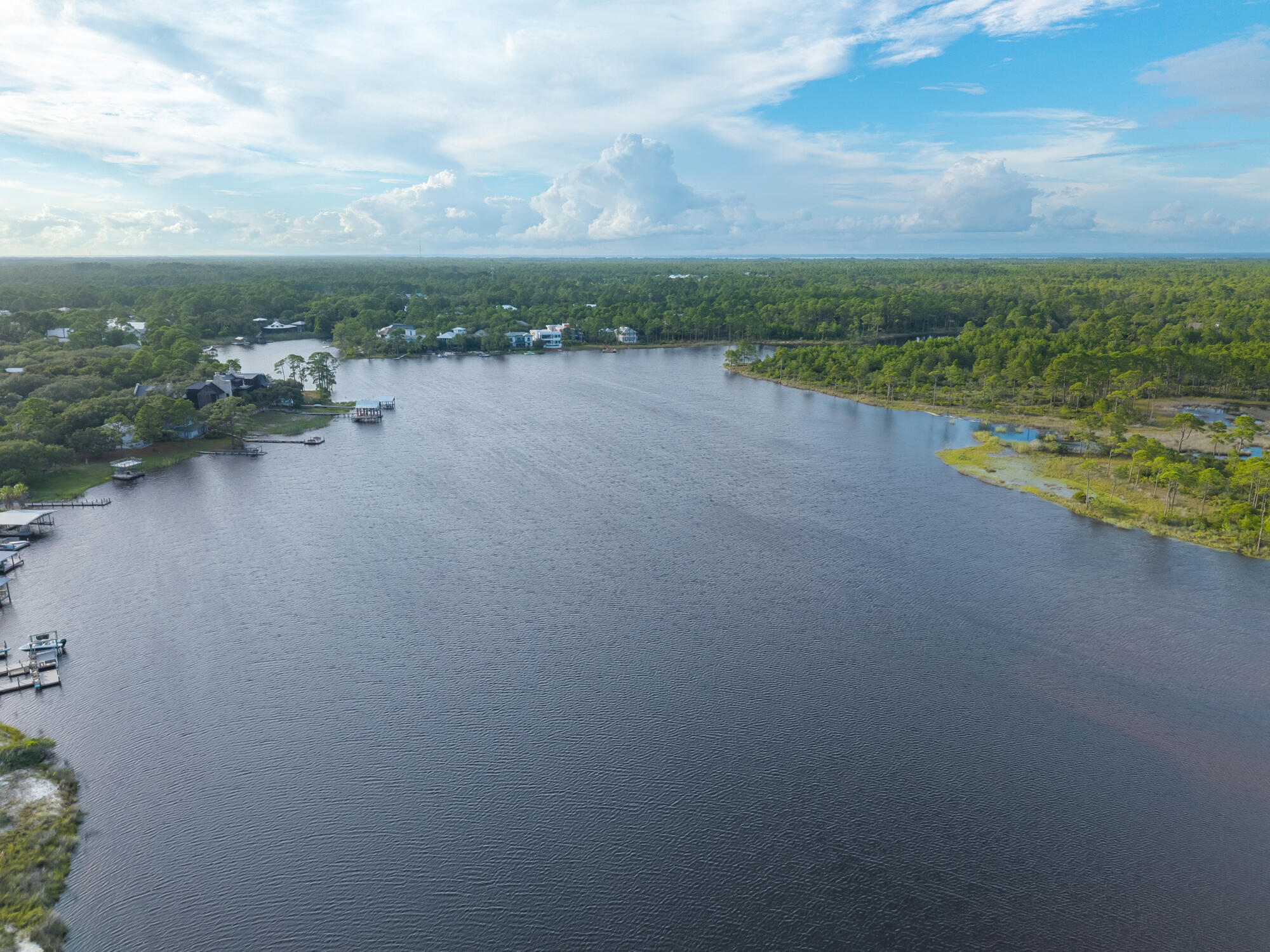 180 Wilderness Way Santa Rosa Beach, FL 32459 - Photo 47 of 69 a view of a lake with houses in the back