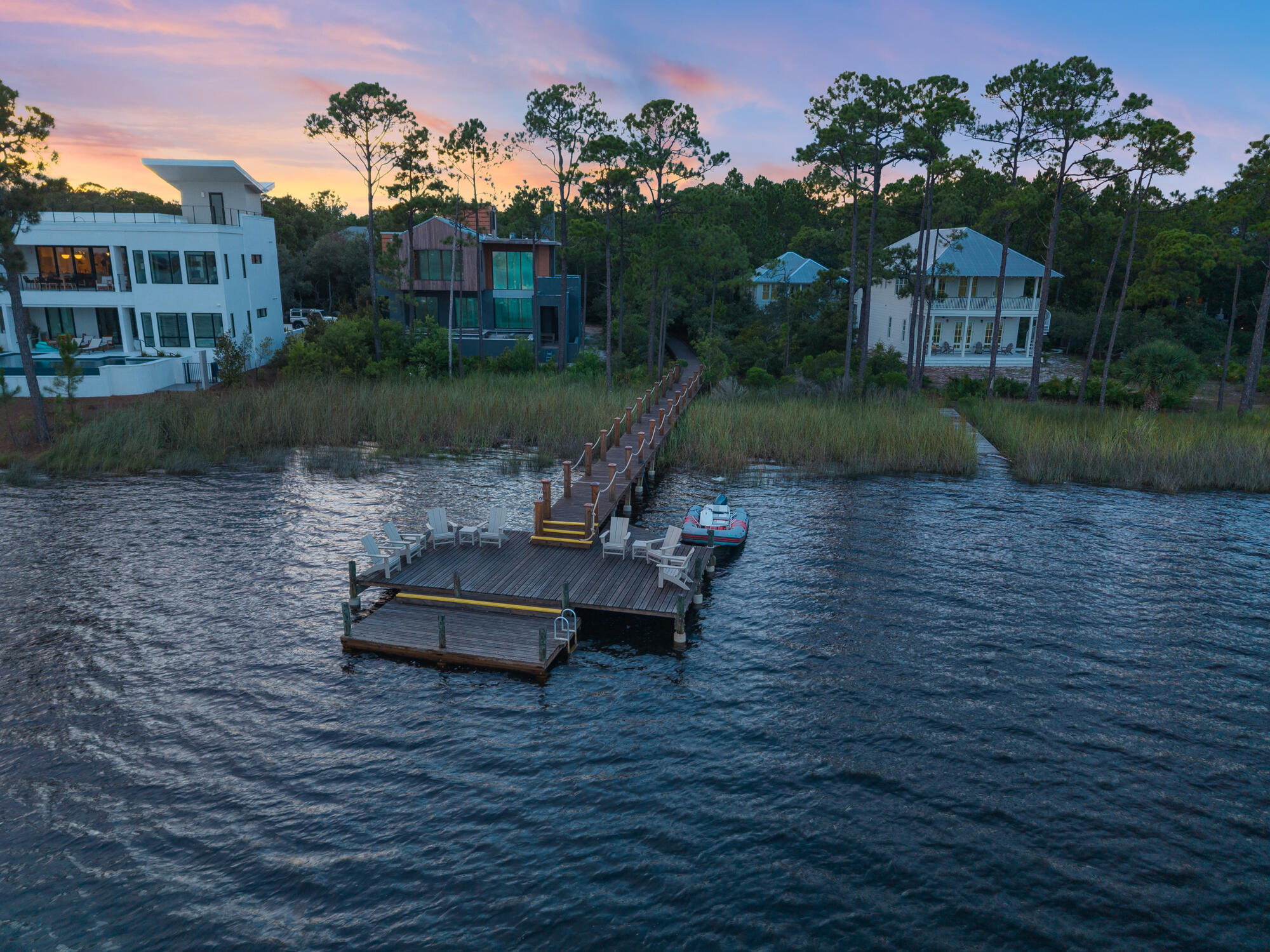 180 Wilderness Way Santa Rosa Beach, FL 32459 - Photo 53 of 69 a view of a lake with a yard and large trees