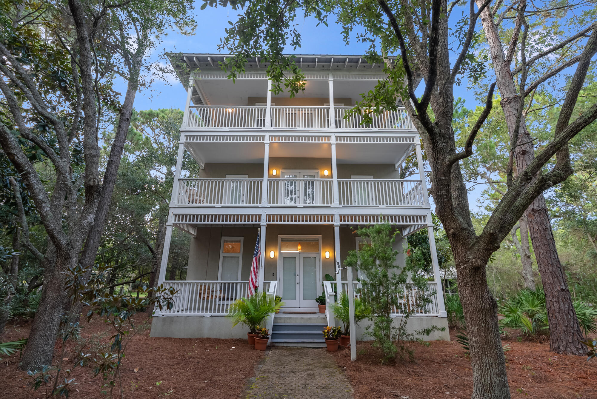 180 Wilderness Way Santa Rosa Beach, FL 32459 - Photo 57 of 69 a front view of a house with a garden