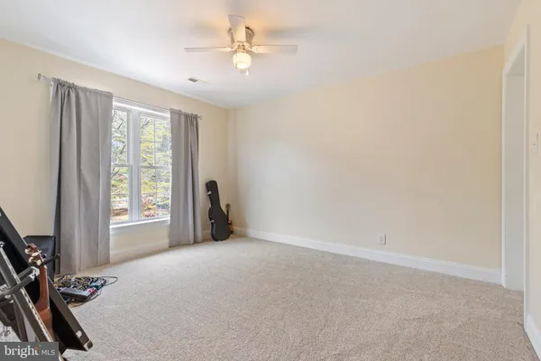 a view of a big room with windows and closet