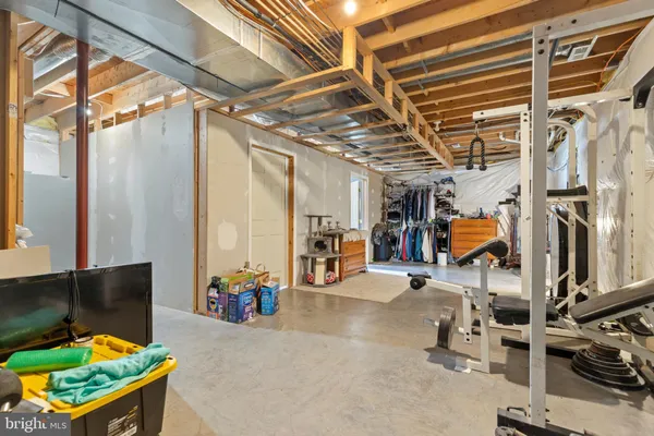 a spacious bedroom with a bed next to a window