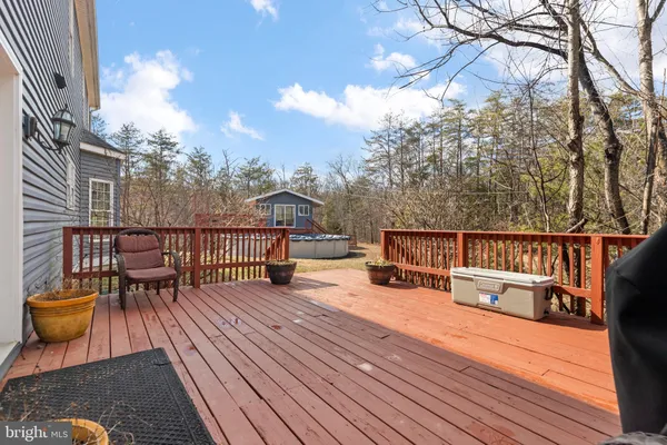 a view of a house with a wooden fence