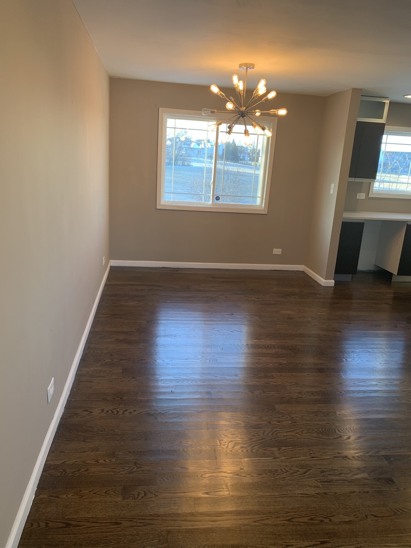 38 Wedgewood Road Matteson, IL 60443 - Photo 6 of 14 an empty room with wooden floor and windows