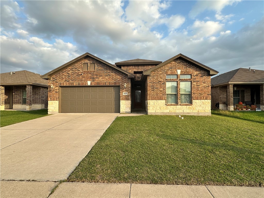 a front view of a house with a yard