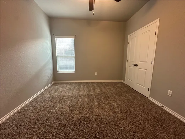 a view of a room that has a window in it