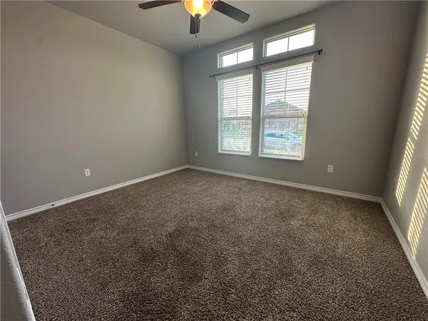 an empty room with a empty space and a window