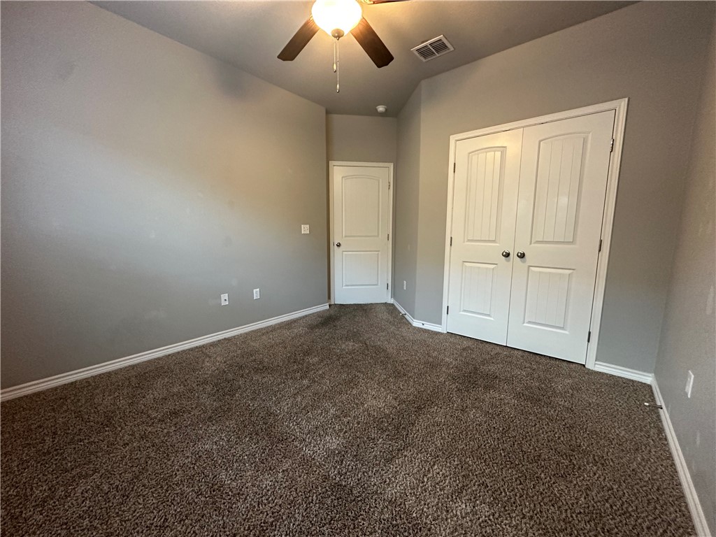 1015 Santa Catalina Street Portland, TX 78374 - Photo 23 of 34 an empty room with a ceiling fan and window