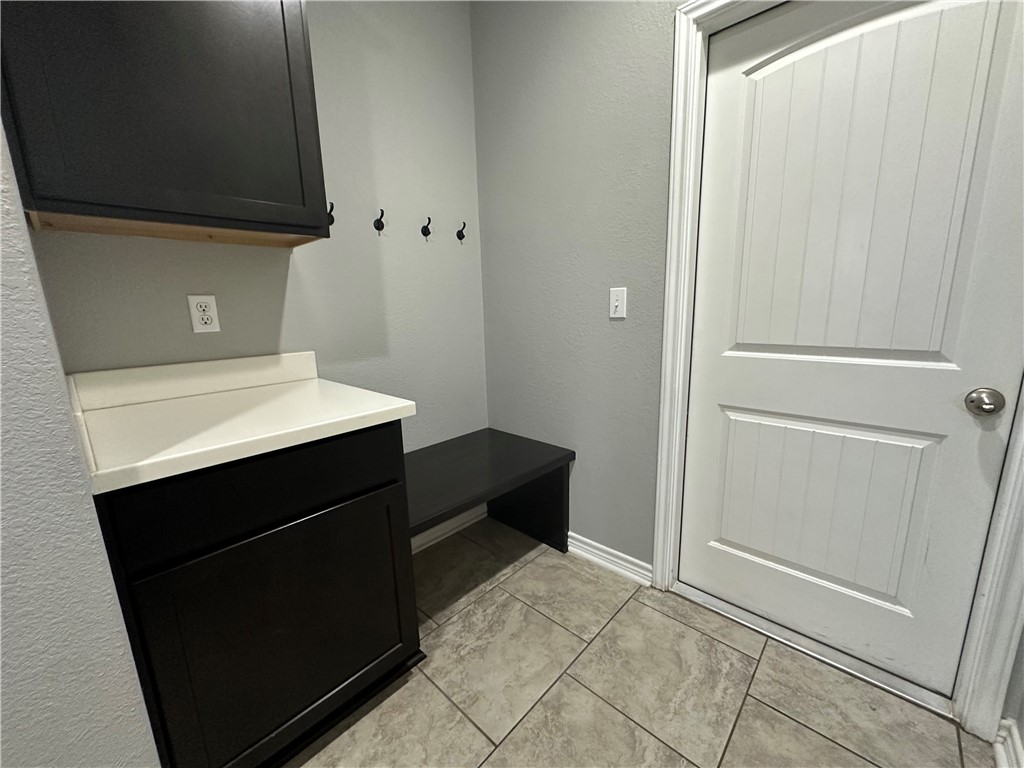 1015 Santa Catalina Street Portland, TX 78374 - Photo 29 of 34 a kitchen with a sink and a refrigerator