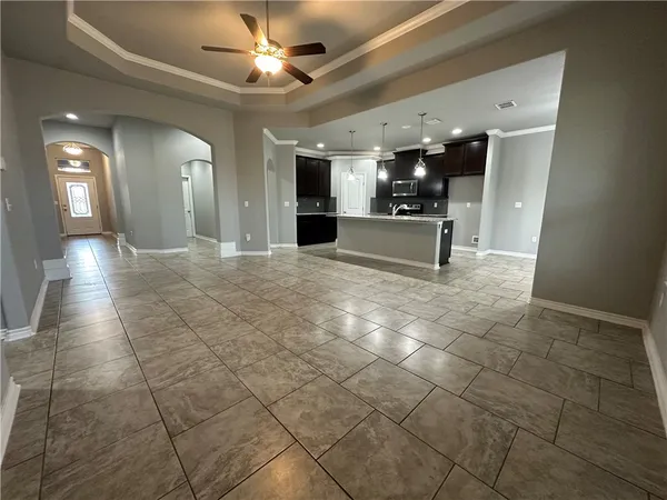 a view of a hallway with seating space