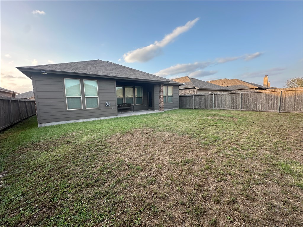 1015 Santa Catalina Street Portland, TX 78374 - Photo 33 of 34 a view of a house with a yard