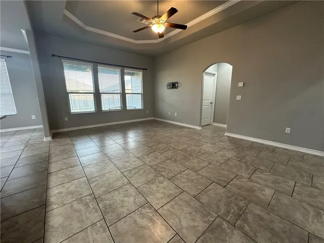 a view of an empty room and window