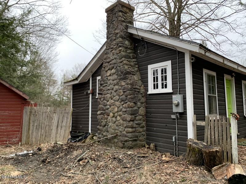 164 Heath Road Colrain, MA 01340 - Photo 4 of 18 a brick house with a large windows