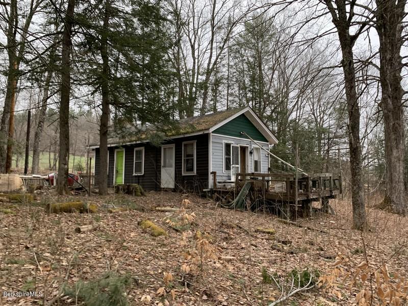 164 Heath Road Colrain, MA 01340 - Photo 7 of 18 a backyard of a house with table and chairs