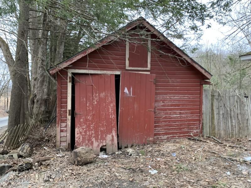 164 Heath Road Colrain, MA 01340 - Photo 8 of 18 a view of a wooden house with a yard