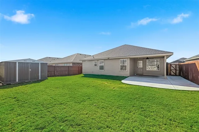 a view of a back yard of the house