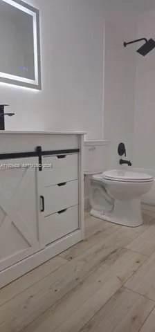 a bathroom with a bathtub and a window