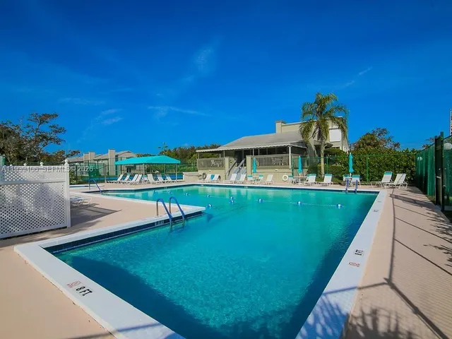 a view of a swimming pool with a patio
