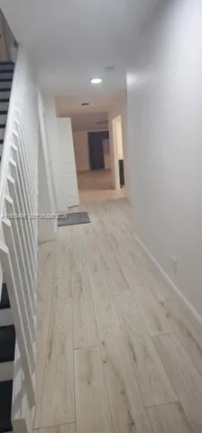 a view of an empty room with a fireplace