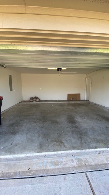 5002 Naples Grove Lane Rosharon, TX 77583 - Photo 35 of 38 Spacious two-car garage with clean concrete floors, ideal for storage or a workshop setup.