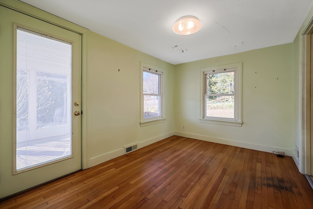 342 Old Connecticut Path Framingham, MA 01701 - Photo 14 of 26 a view of an empty room with wooden floor and a window