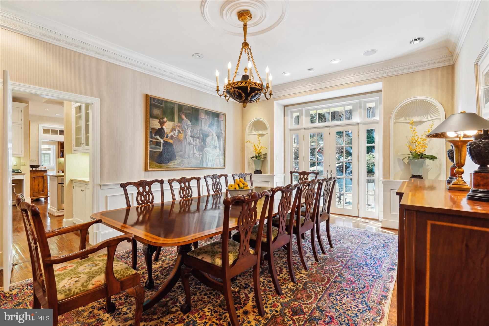 5008 Baltan Road Bethesda, MD 20816 - Photo 19 of 76 a dining room with furniture a chandelier and wooden floor