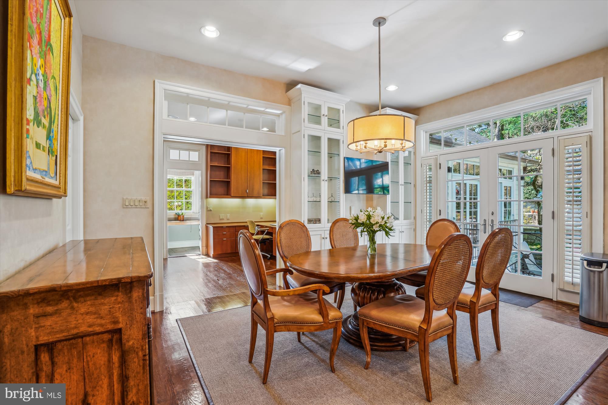 5008 Baltan Road Bethesda, MD 20816 - Photo 24 of 76 a dining room with furniture a chandelier and wooden floor