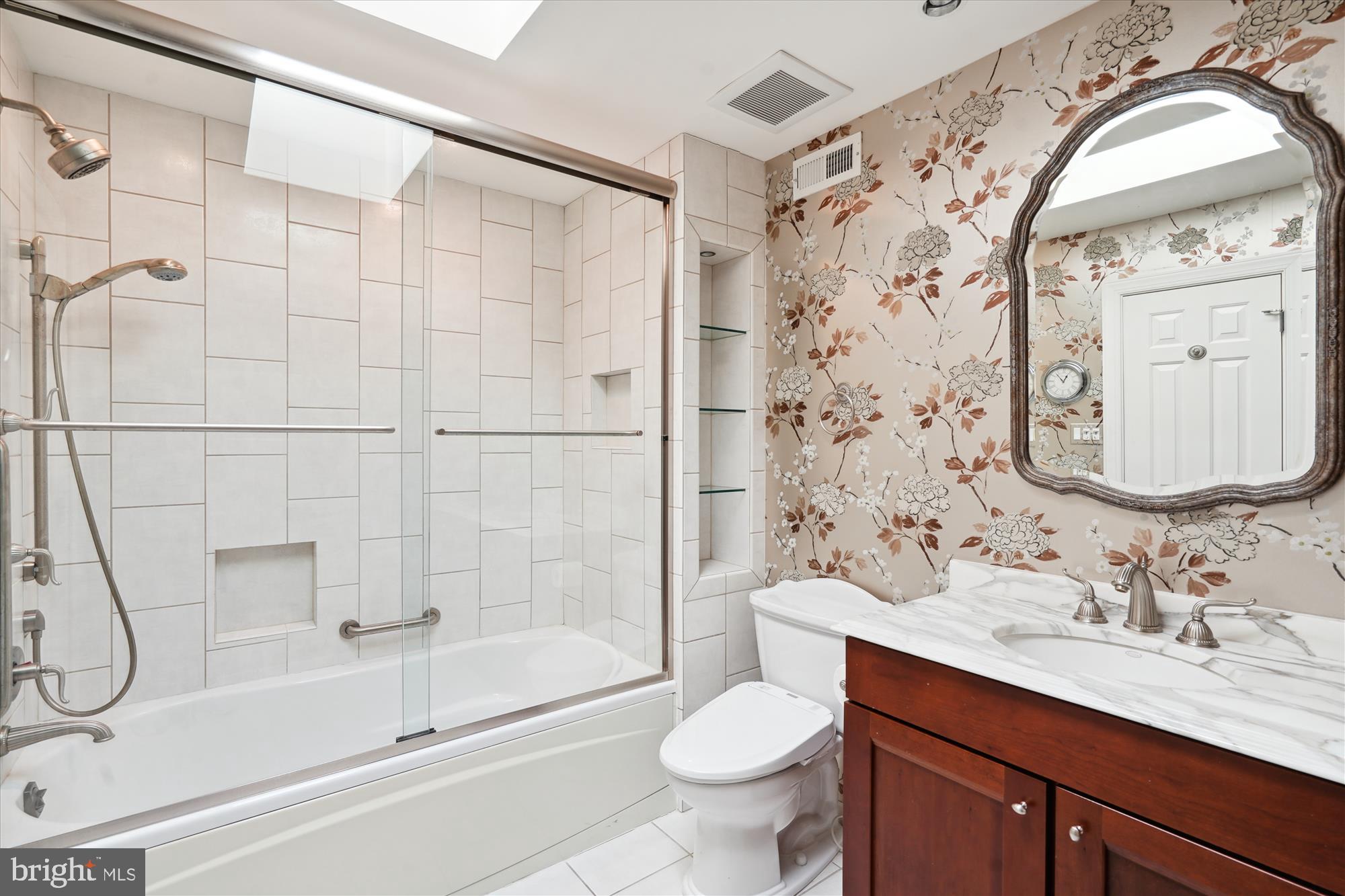 5008 Baltan Road Bethesda, MD 20816 - Photo 51 of 76 a bathroom with a sink toilet and shower